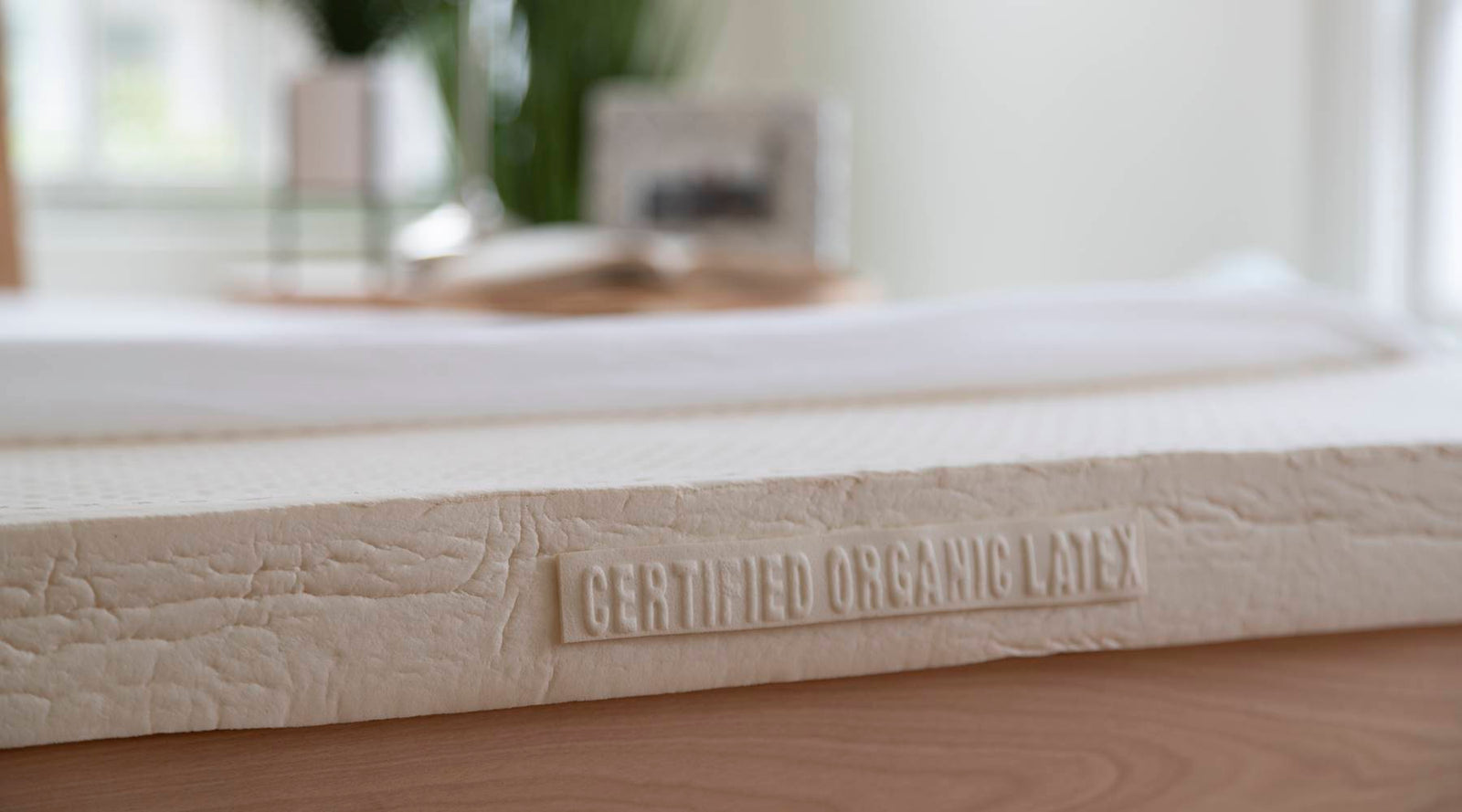 A piece of three inch latex with organic label showing.