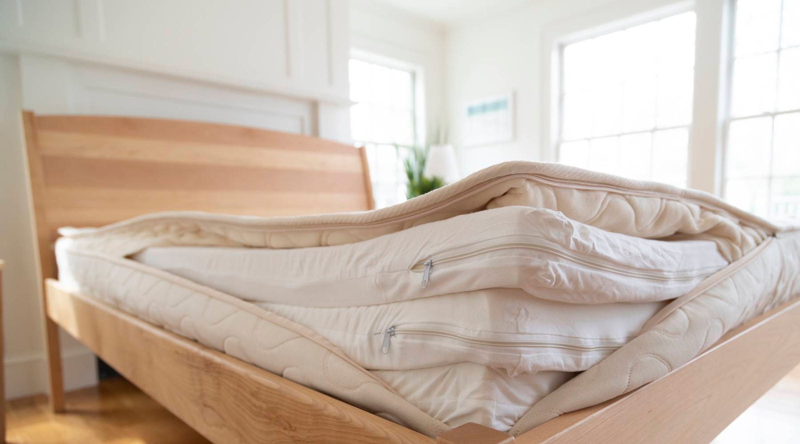 Unzipped Spindle organic mattress cover showing three layers of dunlop latex wrapped in organic cotton.