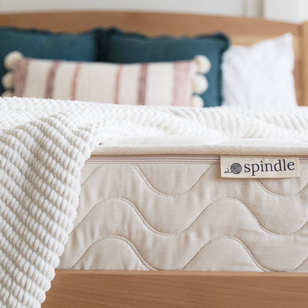 10" Organic Latex Mattress showing the mattress label with Spindle logo.