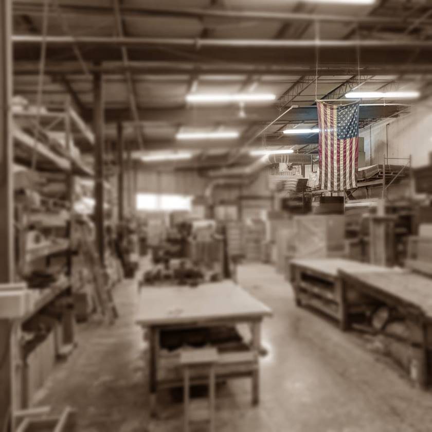 usa flag hanging from ceiling in a workshop