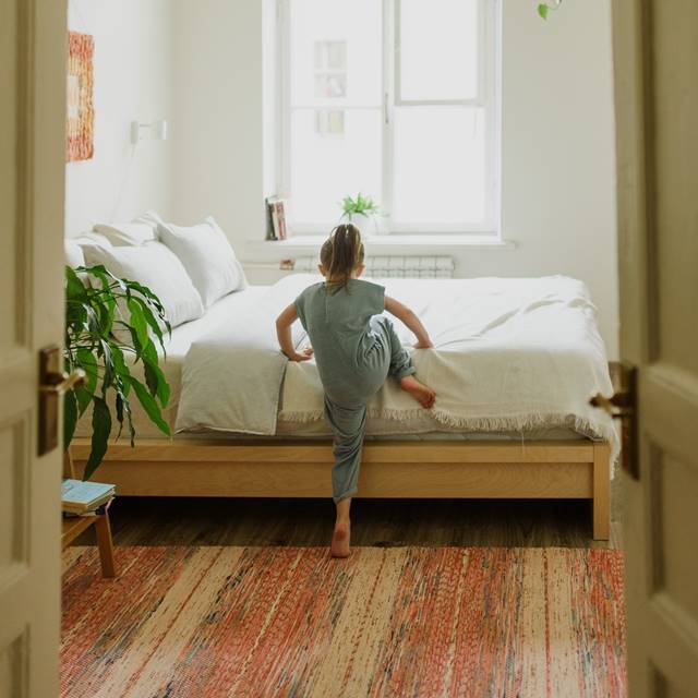 girl-climbing-into-spindle-mattress_1000x.jpg?v=1661198197