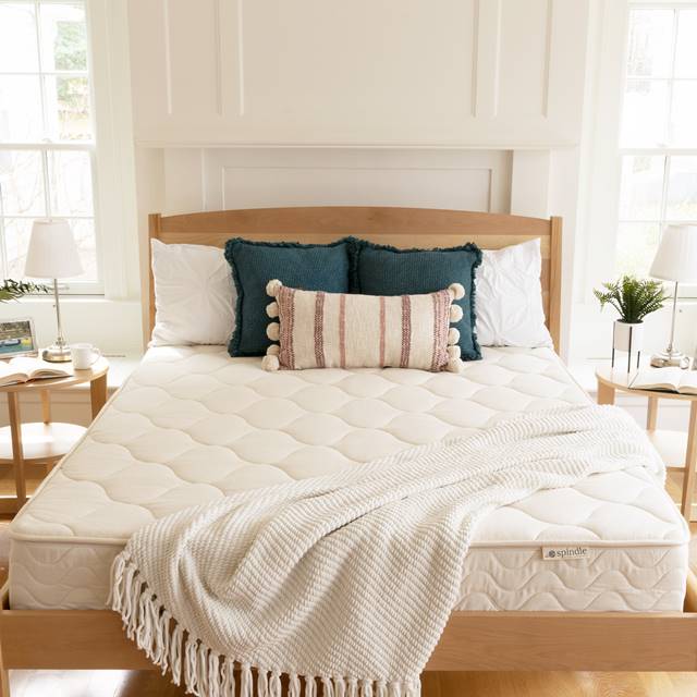 Spindle organic latex mattress in a bedroom.
